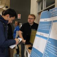 Person taking notes on a senior project